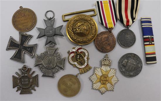 German medals and a medal bar and belt buckle